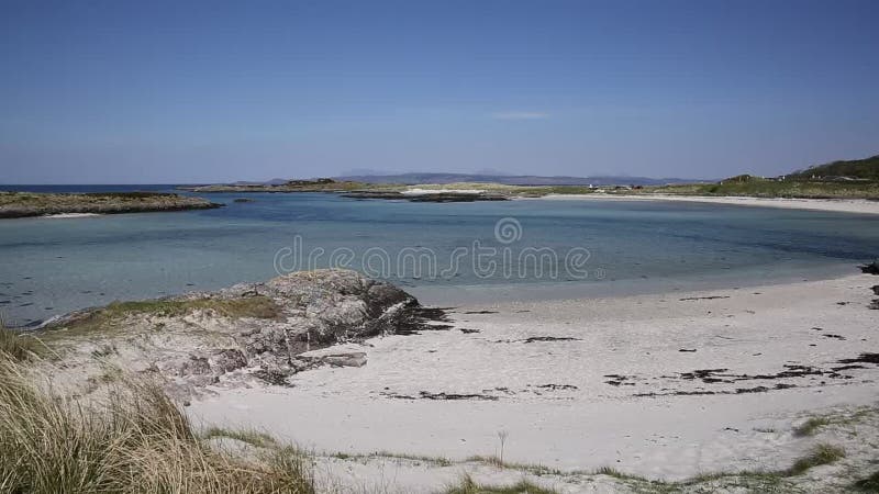 Scottish white sandy beach and clear blue sea Portnaluchaig north of Arisaig west Scotland uk