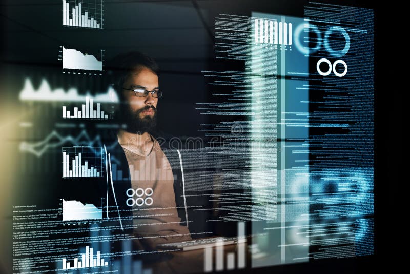 Scouring through reams of data. a young computer programmer working on source code. stock image