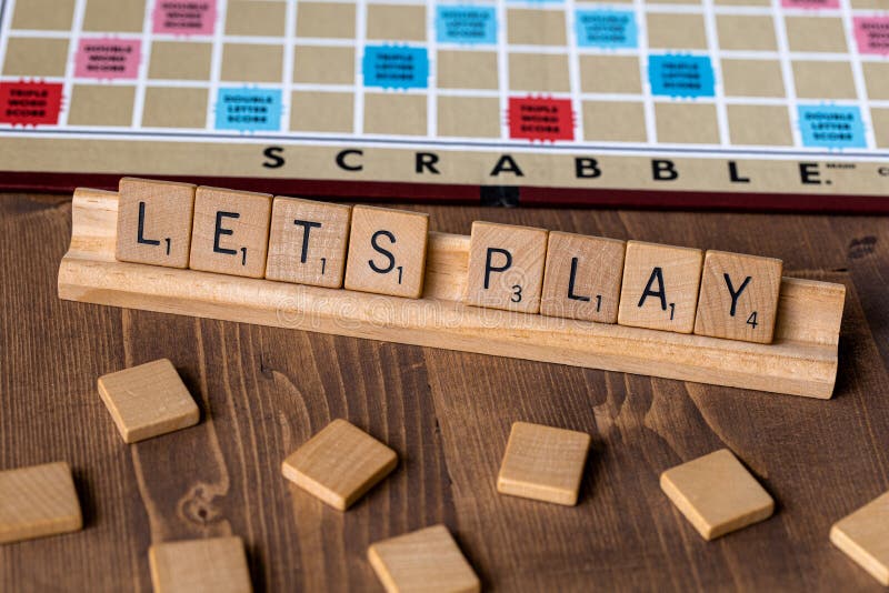 Scrabble board game with the scrabble tile spell `Lets Play`