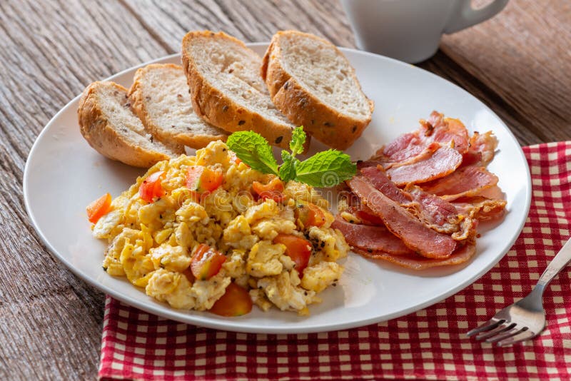 Scrambled Egg with Tomato Sliced, Bacon Grill and Breads, Homemade Breakfast Stock Photo Image