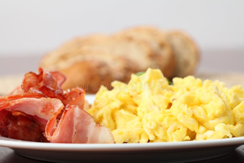 Scrambled eggs and bacon royalty free stock photo