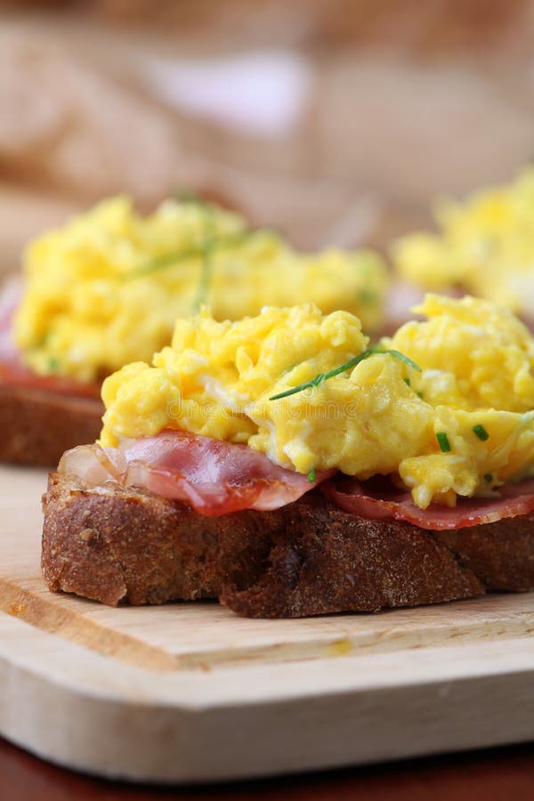 Scrambled eggs and bacon stock image Scrambled eggs and bacon stock image