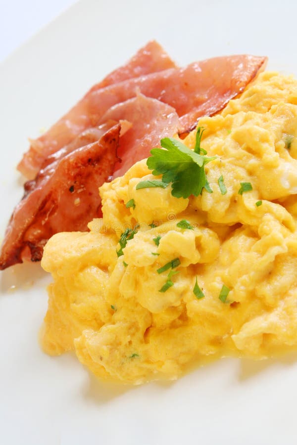 Scrambled eggs and bacon - a delicious breakfast.