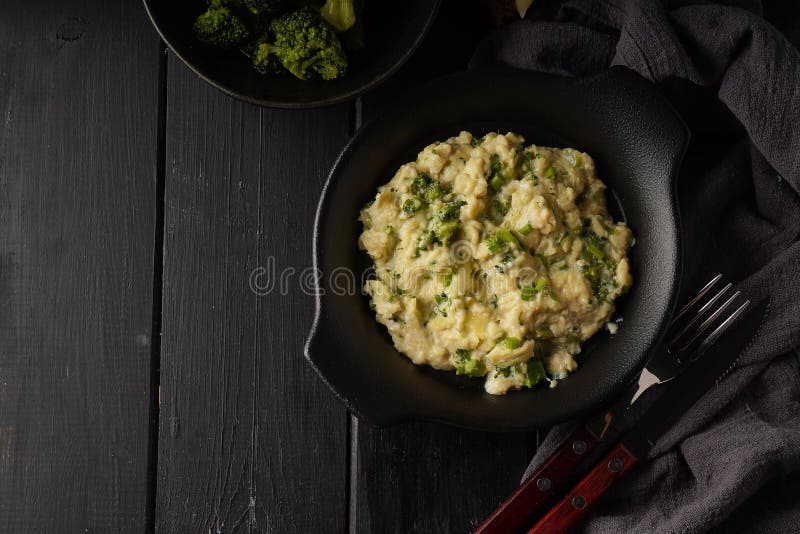 Scrambled Eggs with Broccoli and Green Onion Served in Dark Plate with