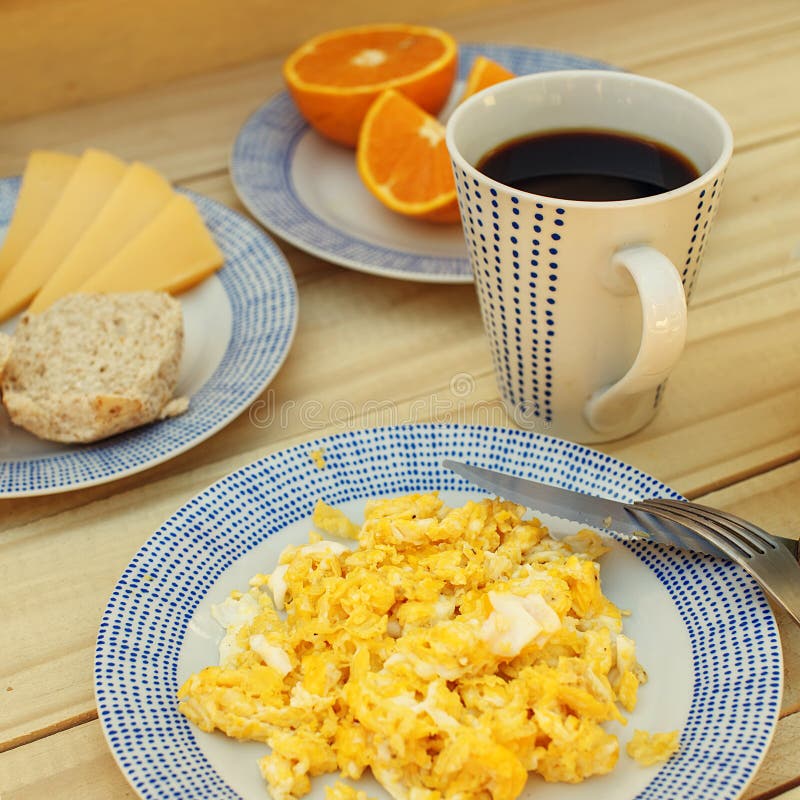 Scrambled Eggs, Coffee, Breakfast on the Wooden Table Stock Image