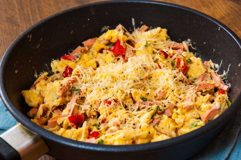 Scrambled Eggs with Ham, Vegetables and Cheese in a Frying Pan Stock ...