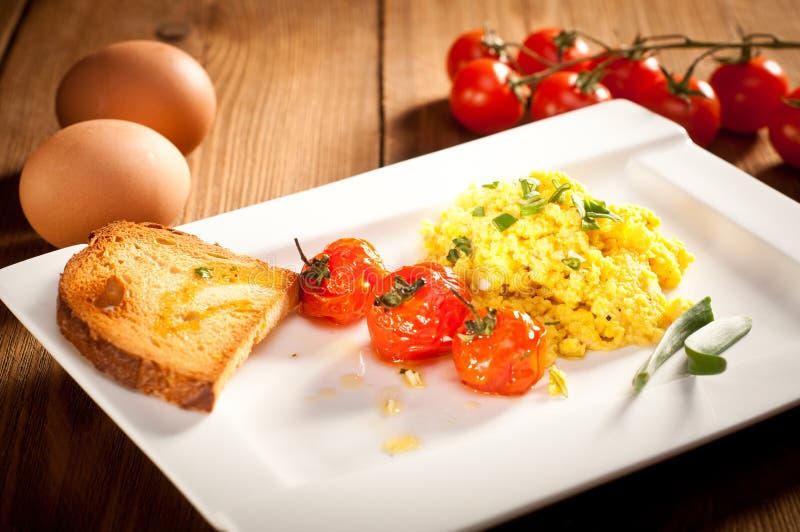 Scrambled Eggs with Roasted Cherry Tomatoes Stock Image Image of delicious, white 40193353