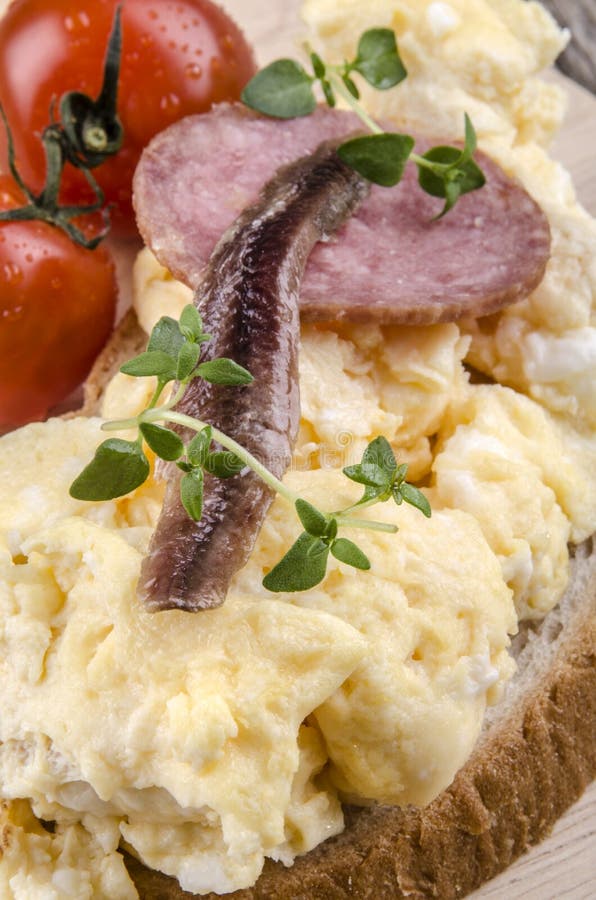 Scrambled Eggs with Salami and Anchovy on Bread Stock Image Image of