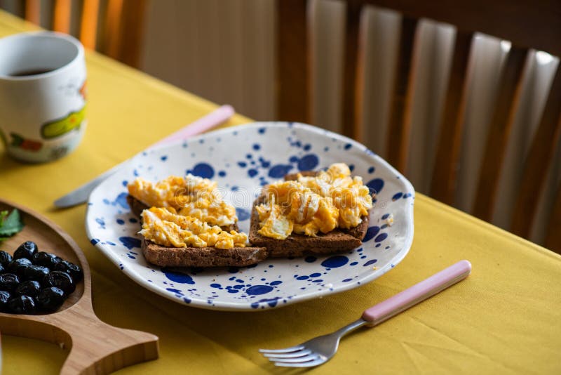 Scrambled Eggs with Cheese and Spring Onion. Served in a Copper Pan