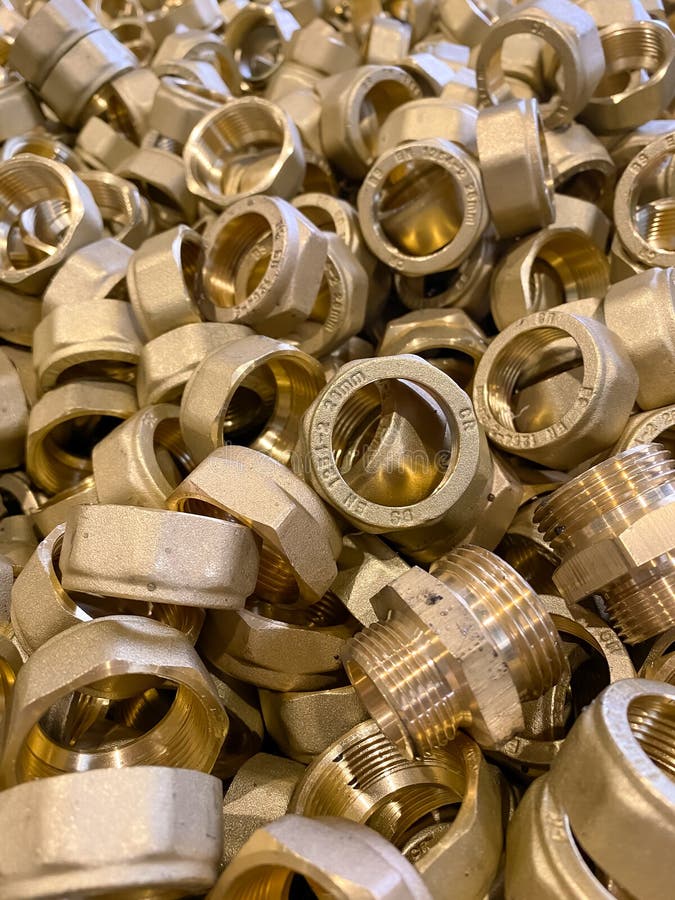 Yellow Brass Scrap Nuts and Bolts Ready To Be Recycled Stock Image