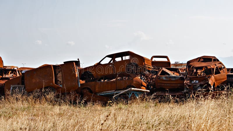 A lot of used cars in the junkyard. A lot of used cars in the junkyard