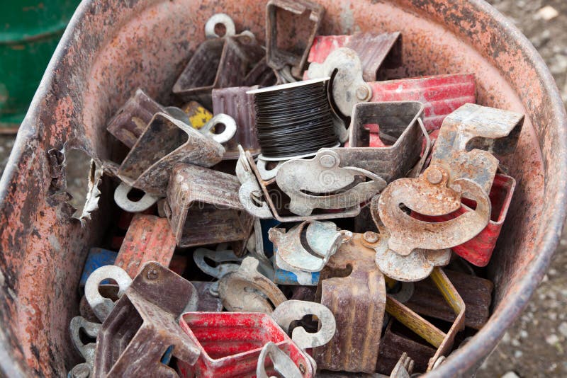 An old rusty fifty gallon barrel holds small pieces of scrap metal in various shapes and colors to be taken for recycling. Metal steel drum stock images, royalty-free photos and pictures