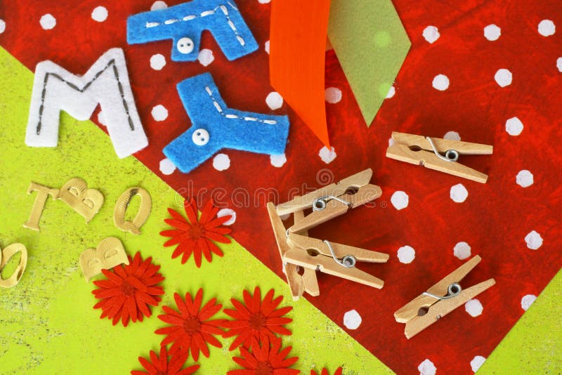 A closeup view of several items and materials used in the art or hobby of scrapbooking. A closeup view of several items and materials used in the art or hobby of scrapbooking.