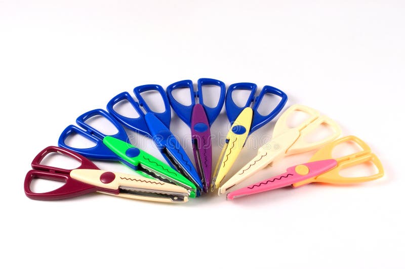 7 paris of scissors used in scrapbooking. Each scissors cuts a different edge on the paper or photograph. 7 paris of scissors used in scrapbooking. Each scissors cuts a different edge on the paper or photograph
