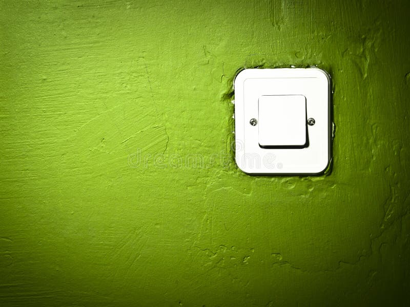 Scratched green paint wall with switch