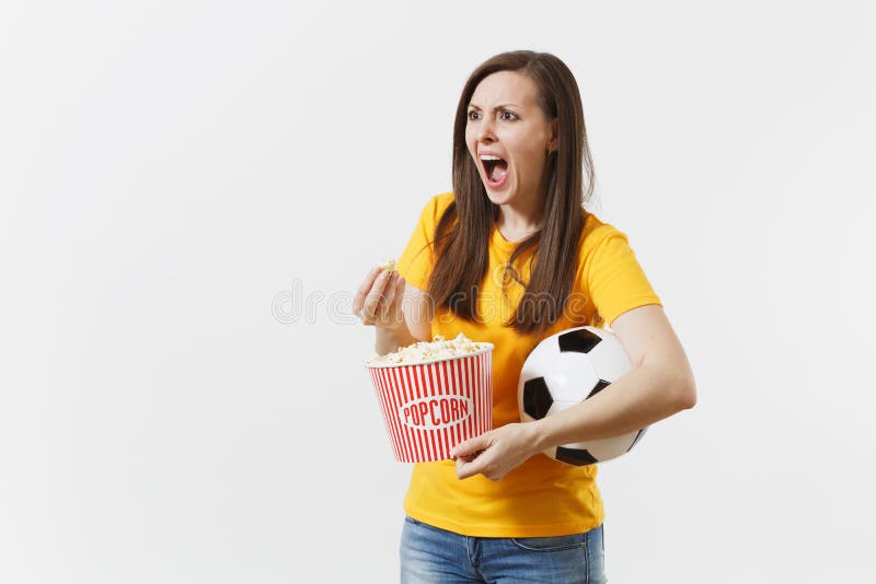 Screaming European woman, football fan holding soccer ball, bucket of popcorn upset of loss or goal of favorite team royalty free stock photos Screaming European woman, football fan holding soccer ball, bucket of popcorn upset of loss or goal of favorite team royalty free stock photos