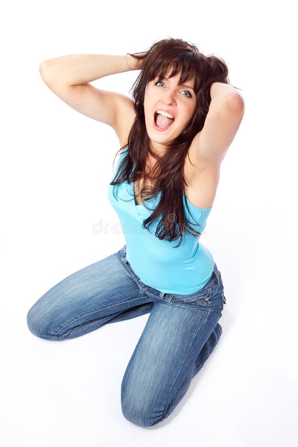 Screaming young woman holding head royalty free stock photography Screaming young woman holding head royalty free stock photography