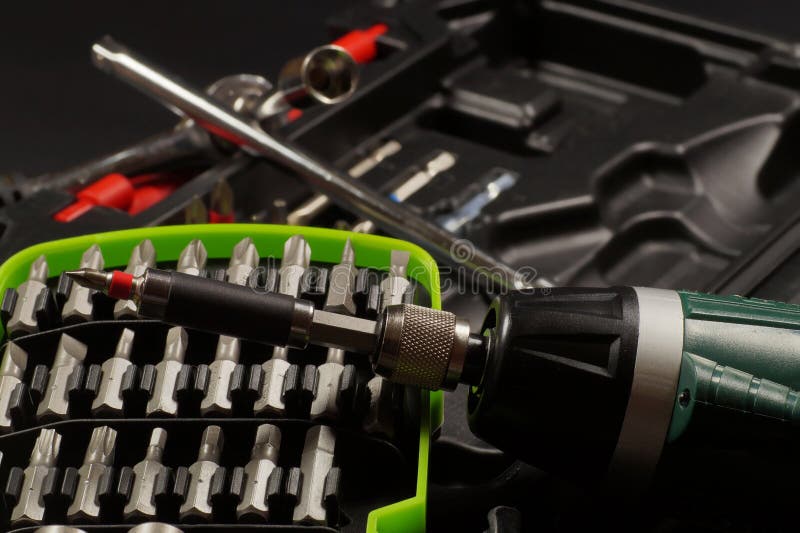 Screwdriver bit set. Cordless with bit holder in the foreground stock photo Screwdriver bit set. Cordless with bit holder in the foreground stock photo