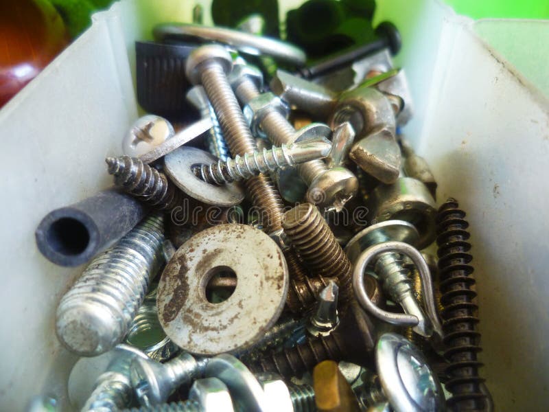Screws, Bolts, Nuts and Washers Closeup in the Garage Stock Photo