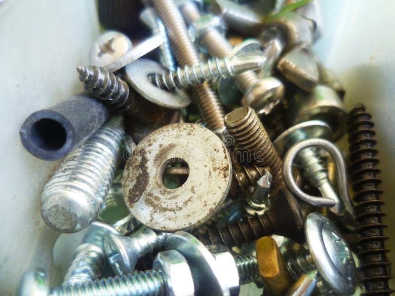 Screws, Bolts, Nuts and Washers Closeup in the Garage Stock Photo