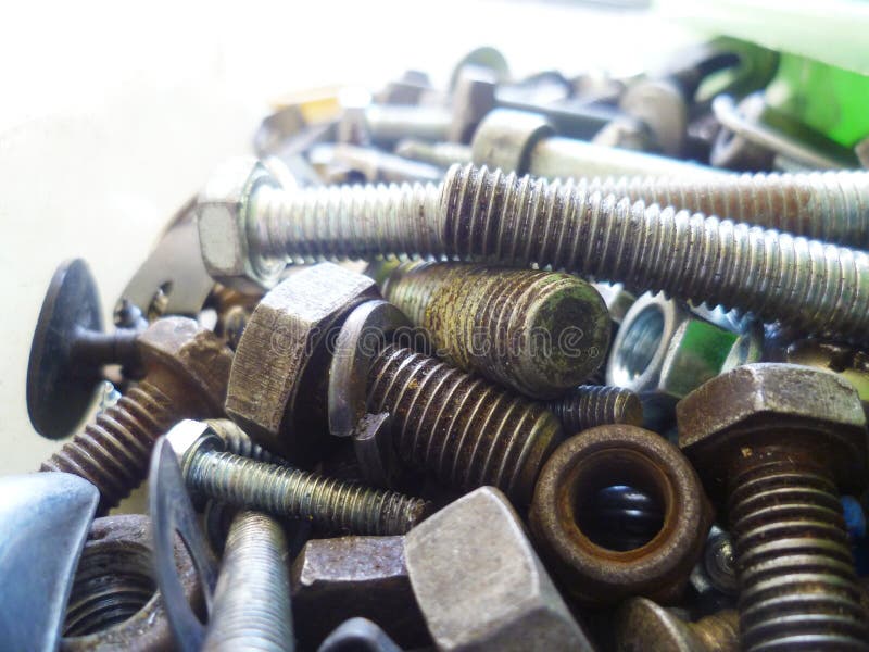 Screws, Bolts, Nuts and Washers Closeup in the Garage Stock Photo
