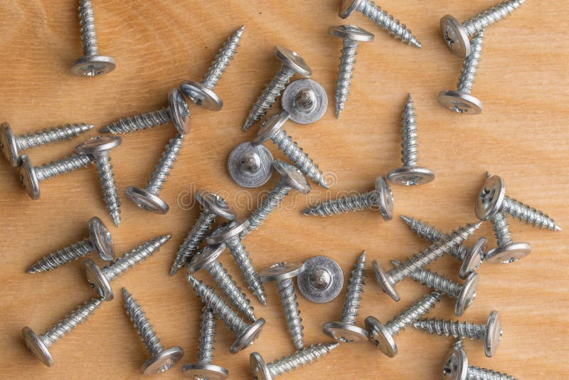 Screws, Lying on a Wooden Table. Carpenter Screws Stock Photo Image