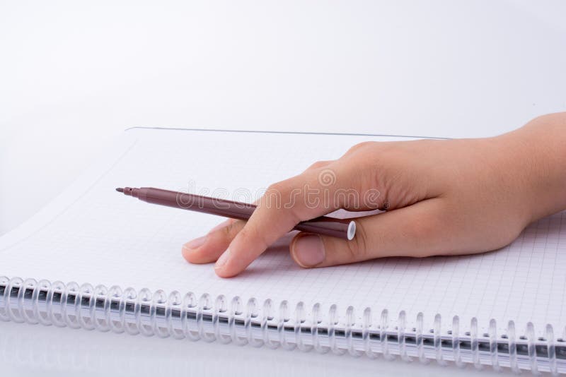 Scrittura della mano su un taccuino fotografia stock libera da diritti