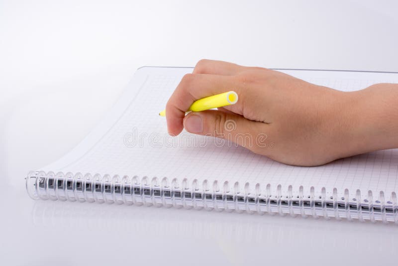 Scrittura della mano su un taccuino fotografia stock libera da diritti