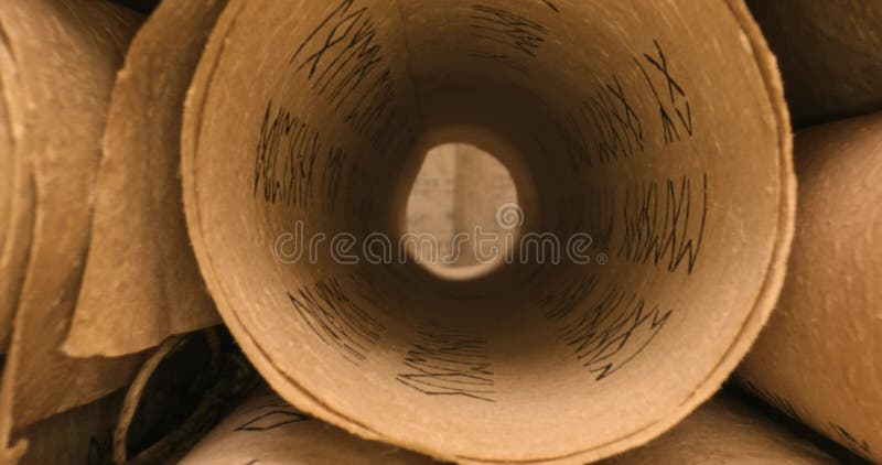 Ancient scrolls stacked on pile. Old scroll library. Stock Photo