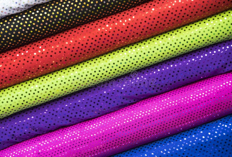 Scrolls rolls colored colorful fabric. Choice, organization.