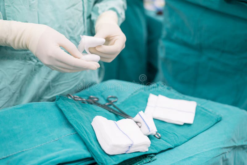 Scrub nurse praparing instruments for open heart operation