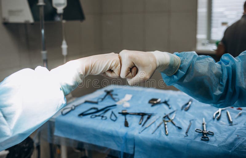 Scrub Nurse Preparing Medical Instruments for Operation Stock Photo