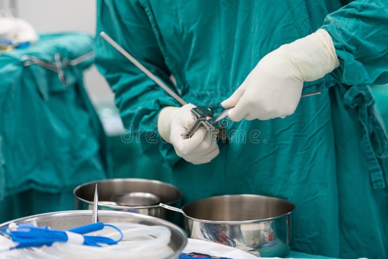 Scrub Nurse Preparing Tools for Operation Stock Image Image of