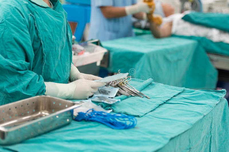 Scrub Nurse Preparing Tools for Operation Stock Photo Image of metal, medical 43679084