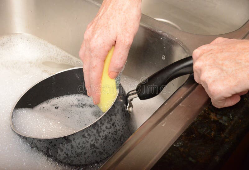 Scrubbing Pot While Washing Dishes Stock Image Image of housecleaning