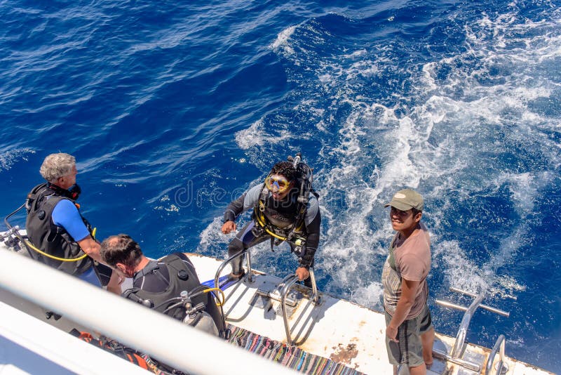 Scuba diver in his gear on a dive boat