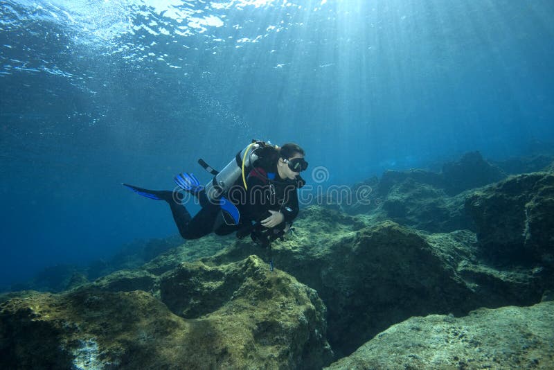 Scuba-Diver in shallow water royalty free stock image