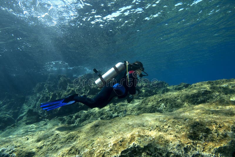 Scuba-Diver in shallow water royalty free stock images