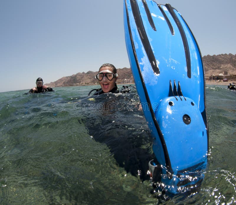 Scuba diver shows her fins