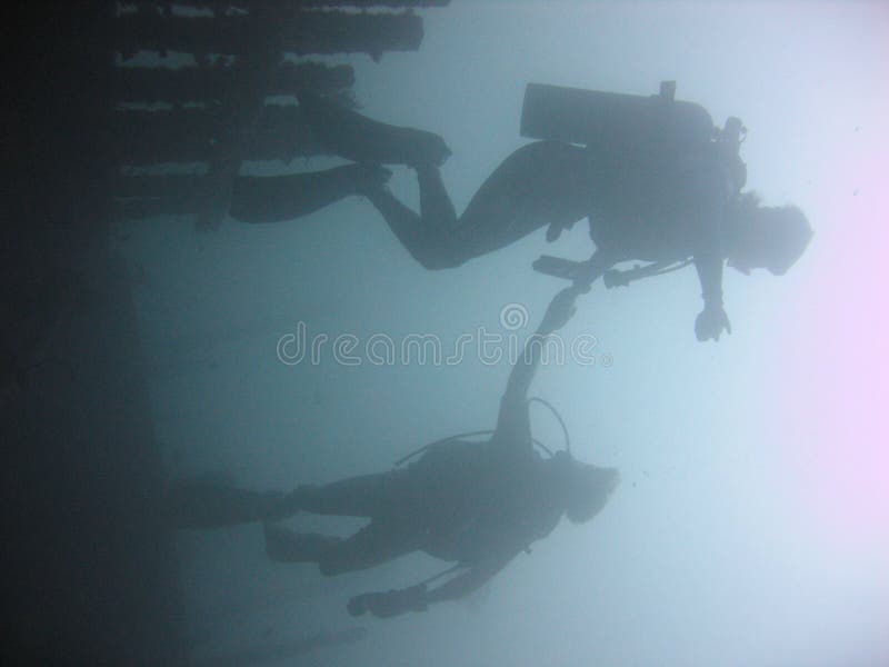 Scuba divers diving sabang wrecks puerta galera