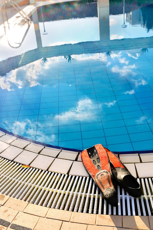 Scuba on the edge of outdoor pool royalty free stock photography
