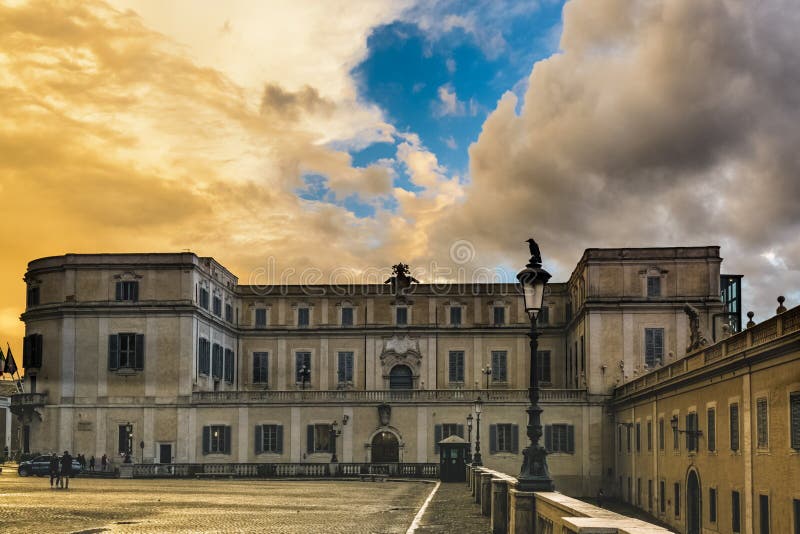 Scuderie del Quirinale Palace in rome. On a autumn sunday morning after rain with reflecting effects on wet pavement under a blue cloudy sky royalty free stock photo Scuderie del Quirinale Palace in rome. On a autumn sunday morning after rain with reflecting effects on wet pavement under a blue cloudy sky royalty free stock photo