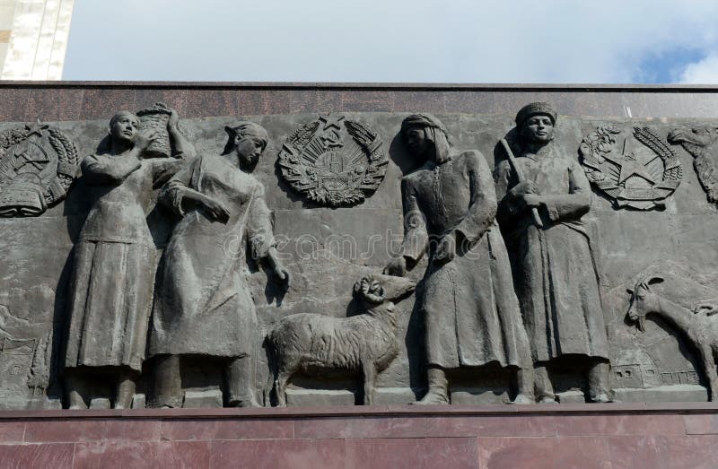 Sculptural composition-bas-relief at the foot of the monument `Worker and Collective Farm Girl` in Moscow. royalty free stock photography Sculptural composition-bas-relief at the foot of the monument `Worker and Collective Farm Girl` in Moscow. royalty free stock photography