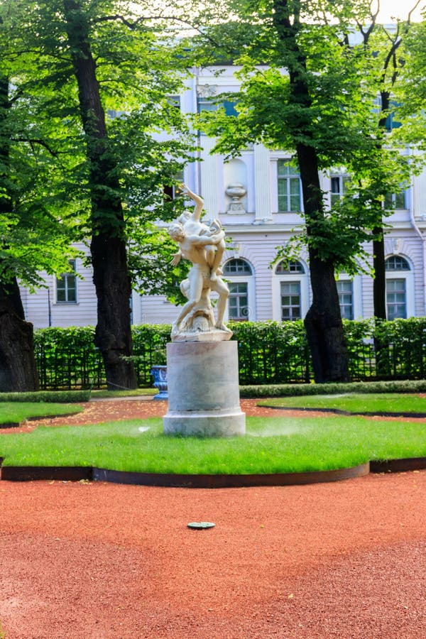 Sculptural composition Kidnapping of Sabine Woman in old city park Summer Garden in St. Petersburg, Russia stock photo Sculptural composition Kidnapping of Sabine Woman in old city park Summer Garden in St. Petersburg, Russia stock photo