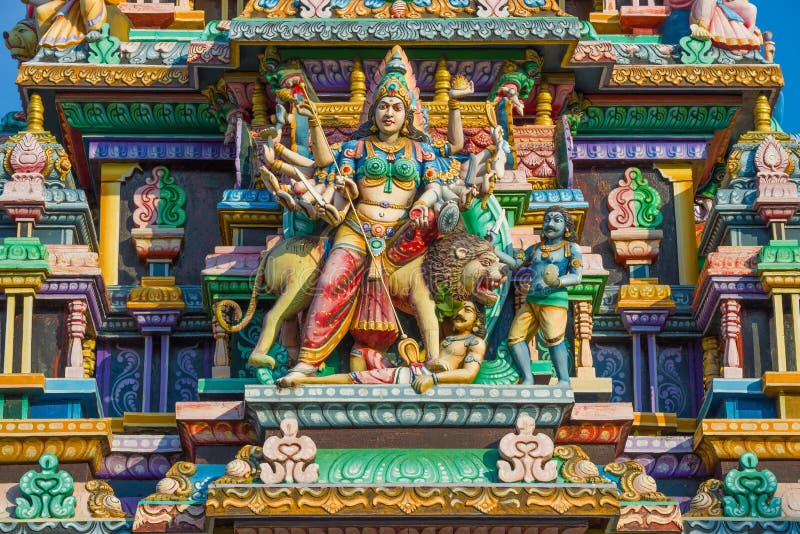 Sculpture of the many-armed god Shiva in the design of the Hindu temple Sri Bhadrakali Amman Kovil Kali Kovil close-up. Trincomalee, Sri Lanka. Sculpture of the many-armed god Shiva in the design of the Hindu temple Sri Bhadrakali Amman Kovil Kali Kovil close-up. Trincomalee, Sri Lanka