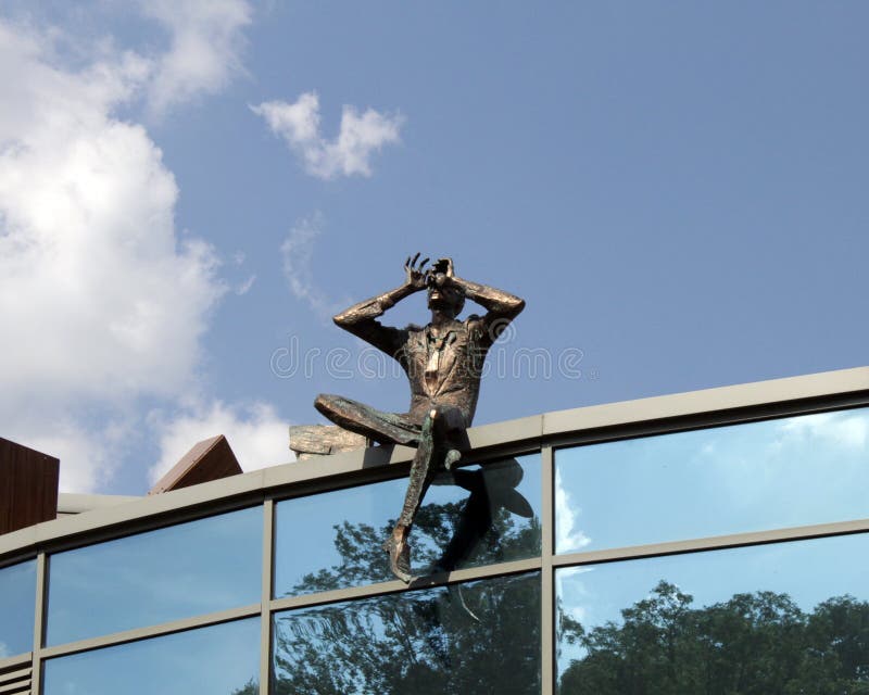 Sculpture Observer on the roof of contemporary building, Kiev, Ukraine.