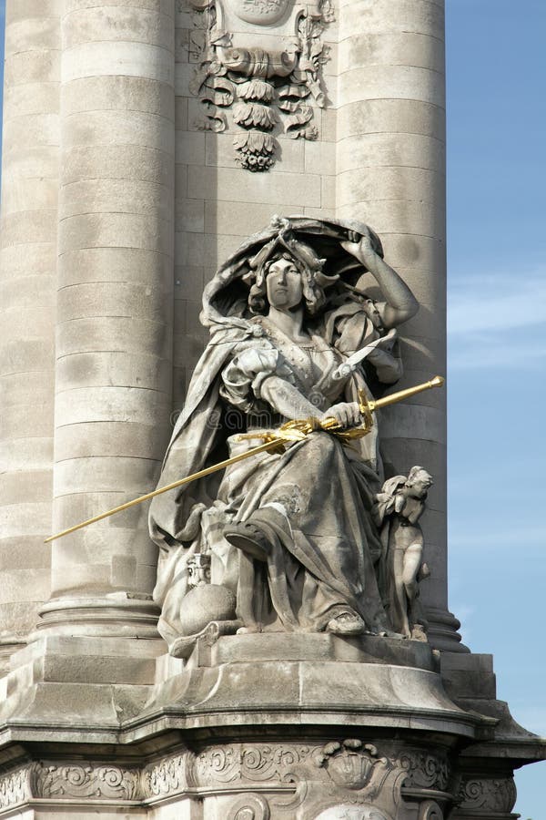 Sculpture on the Pont Alexandre 3 in Paris, expressive and subtle sculptural details. Victory figure with sword