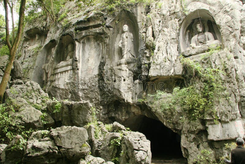Sculture buddisti in Feilai Feng Caves fotografia stock libera da diritti
