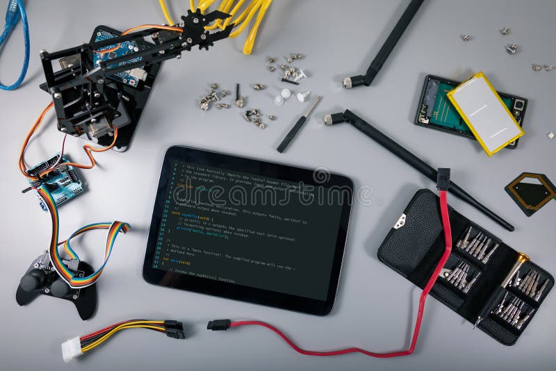 robotics and programming school - electronic items and digital tablet with coding basics. top view. robotics and programming school - electronic items and digital tablet with coding basics. top view