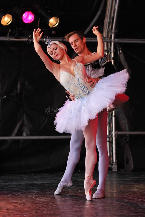 BRISTOL, ENGLAND - August 1: Megan Fairchild and Andrew Veyette of the New York City Ballet perform Swan Lake in the Dance Village at the Harbour Festival in Bristol, England on August 1, 2010. The three day free event had an attendance in excess of 250,000 spectators. BRISTOL, ENGLAND - August 1: Megan Fairchild and Andrew Veyette of the New York City Ballet perform Swan Lake in the Dance Village at the Harbour Festival in Bristol, England on August 1, 2010. The three day free event had an attendance in excess of 250,000 spectators